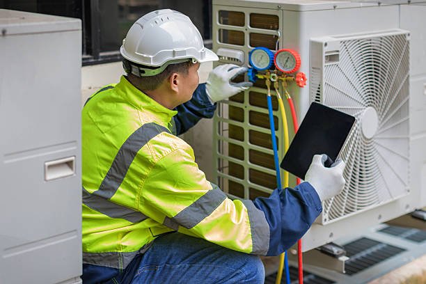 Professional Heat Pump Repair technician working in Howell, MI